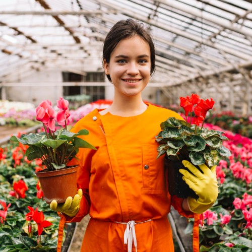 female-gardener-holding-flower-pots